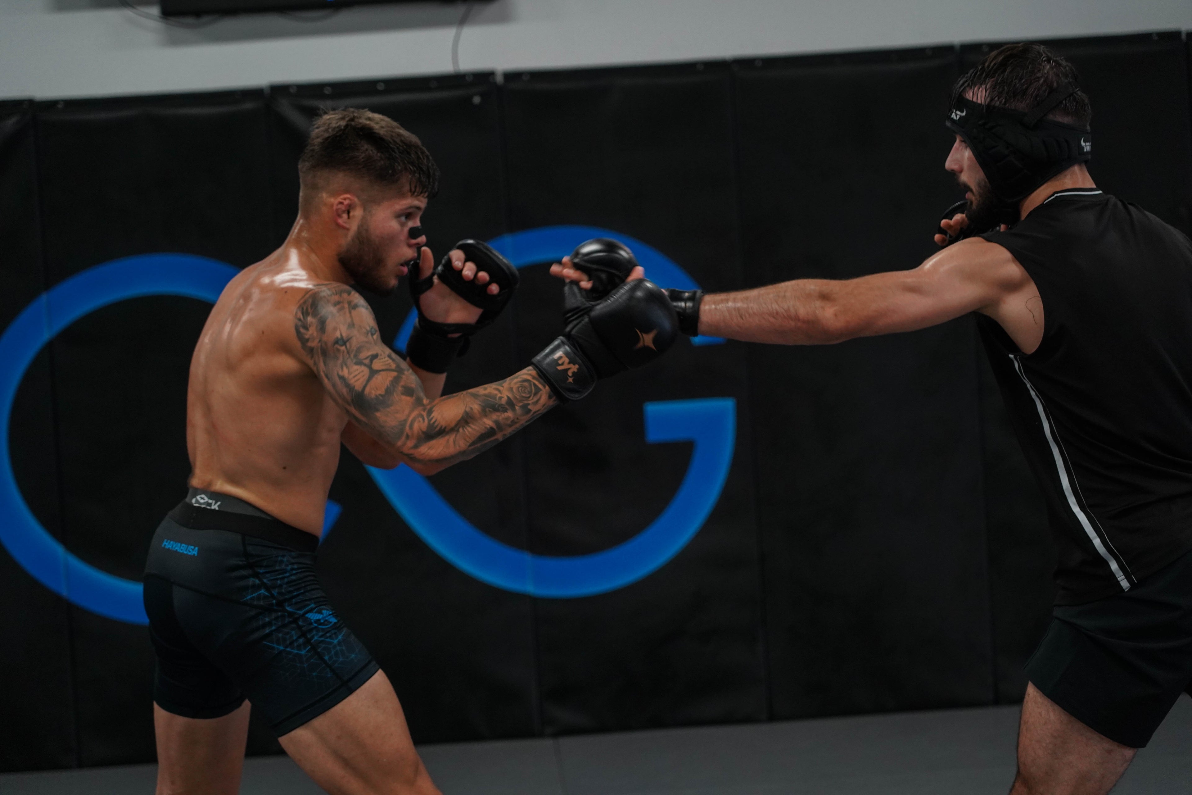 MMA fighter wearing Flow State Performance Nasal Strip during training, showcasing enhanced breathing, endurance, and peak athletic performance.